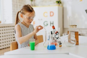 image of child doing an experiment